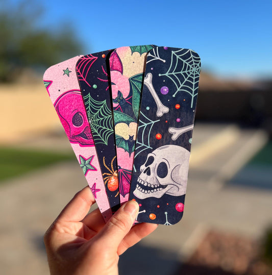 Four colorful 90s style Halloween bookmark designs
